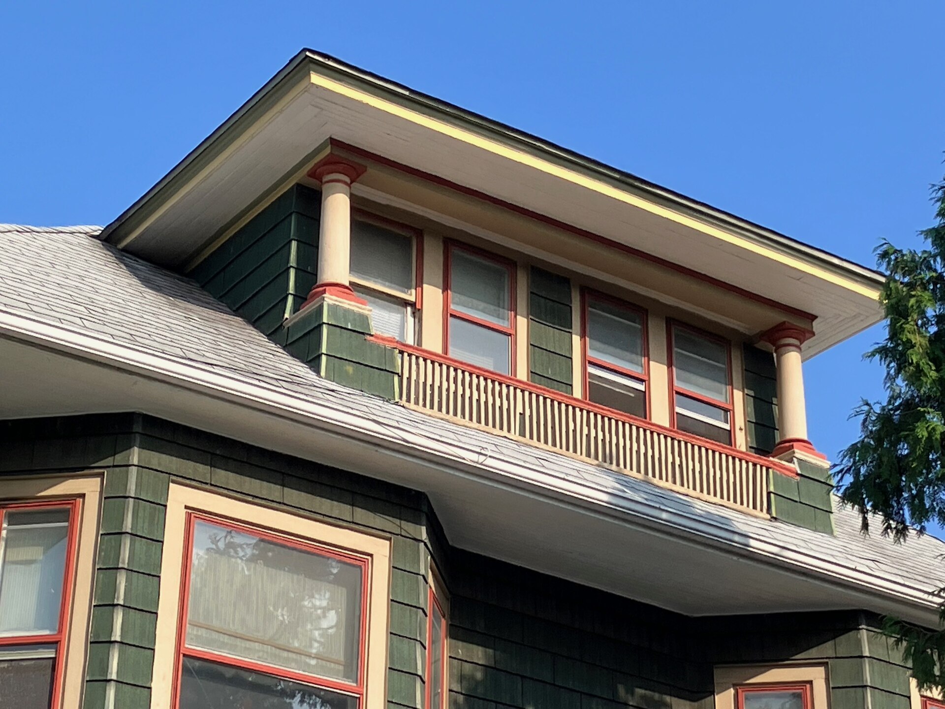 An American Foursquare with hipped roof and full-width front porch