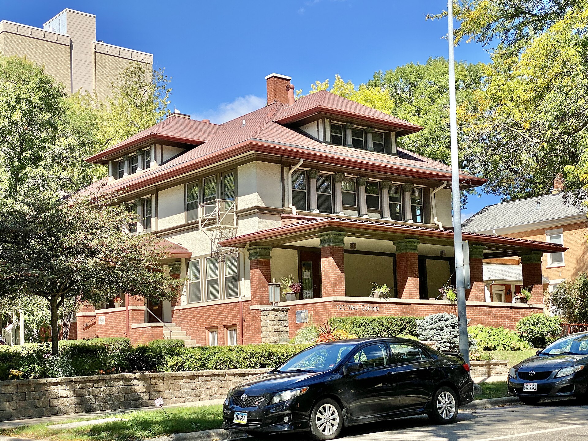 The four-square plan with center hall and wide hipped-roof dormer