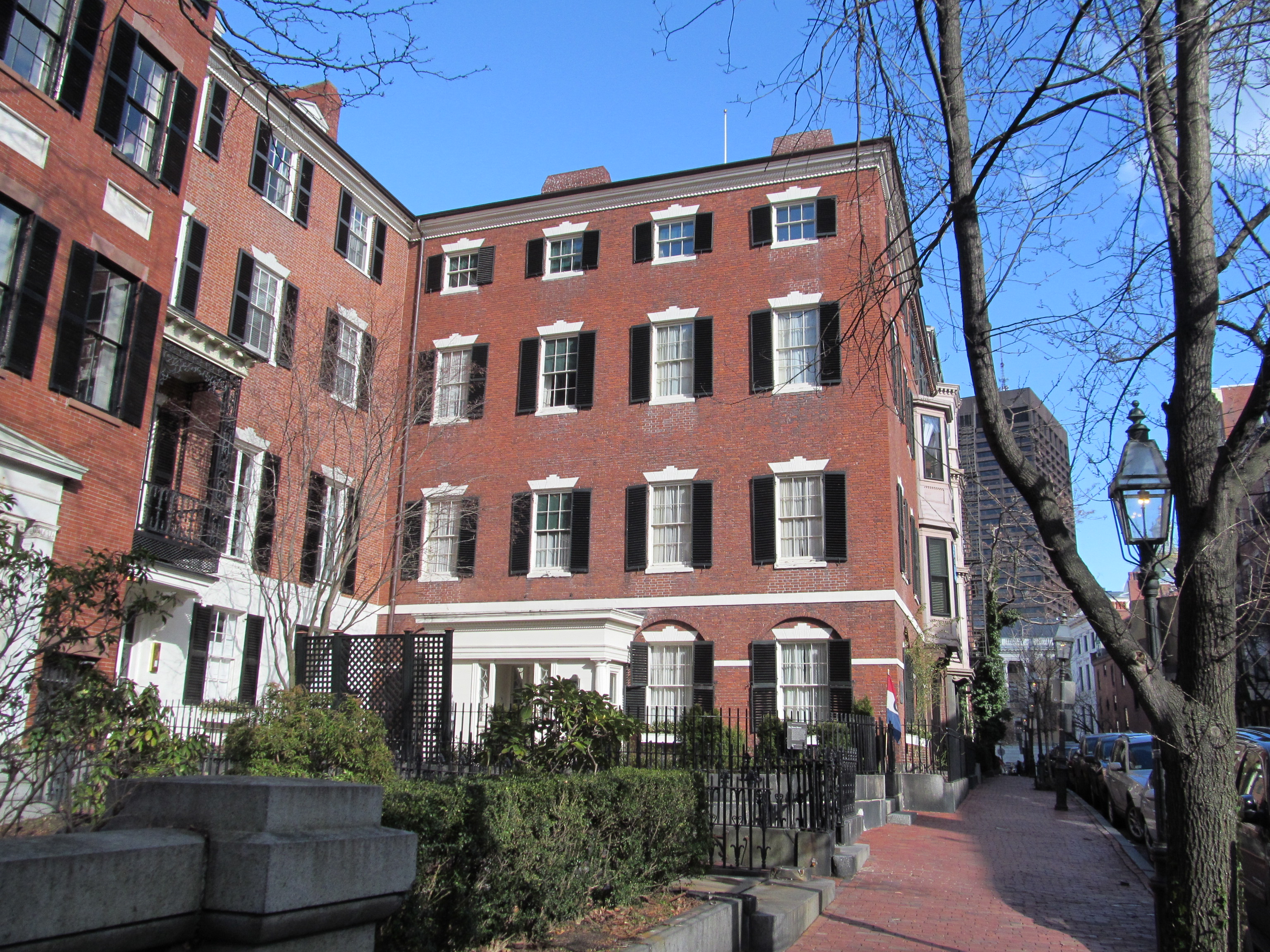 A Back Bay brownstone with high stoop and chocolate-brown sandstone facade