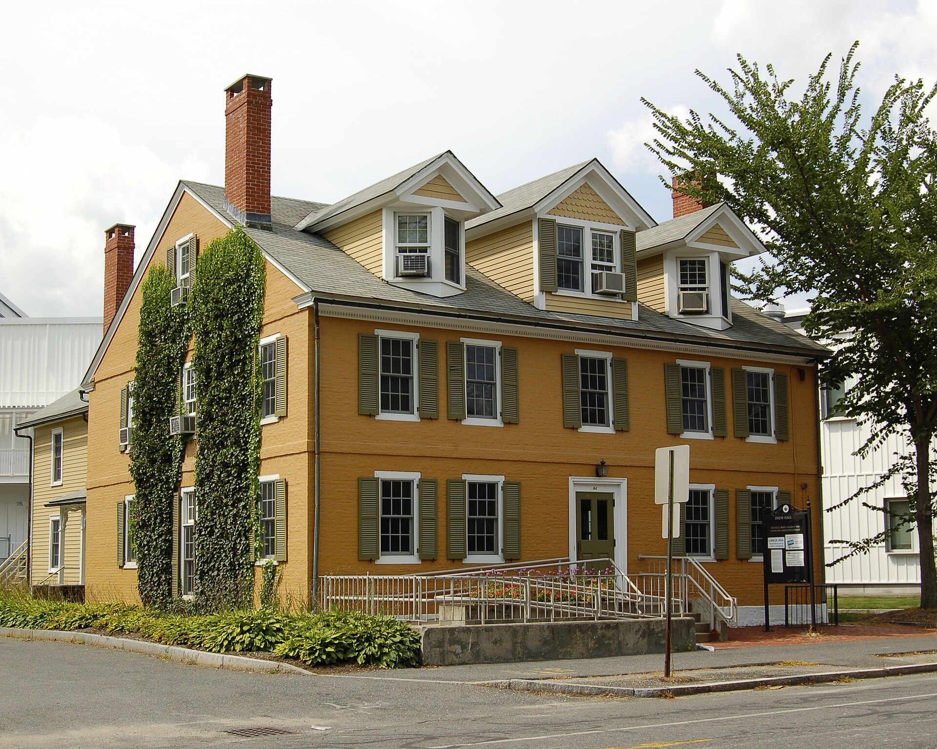 The pediment-and-pilaster door surround is a Georgian signature