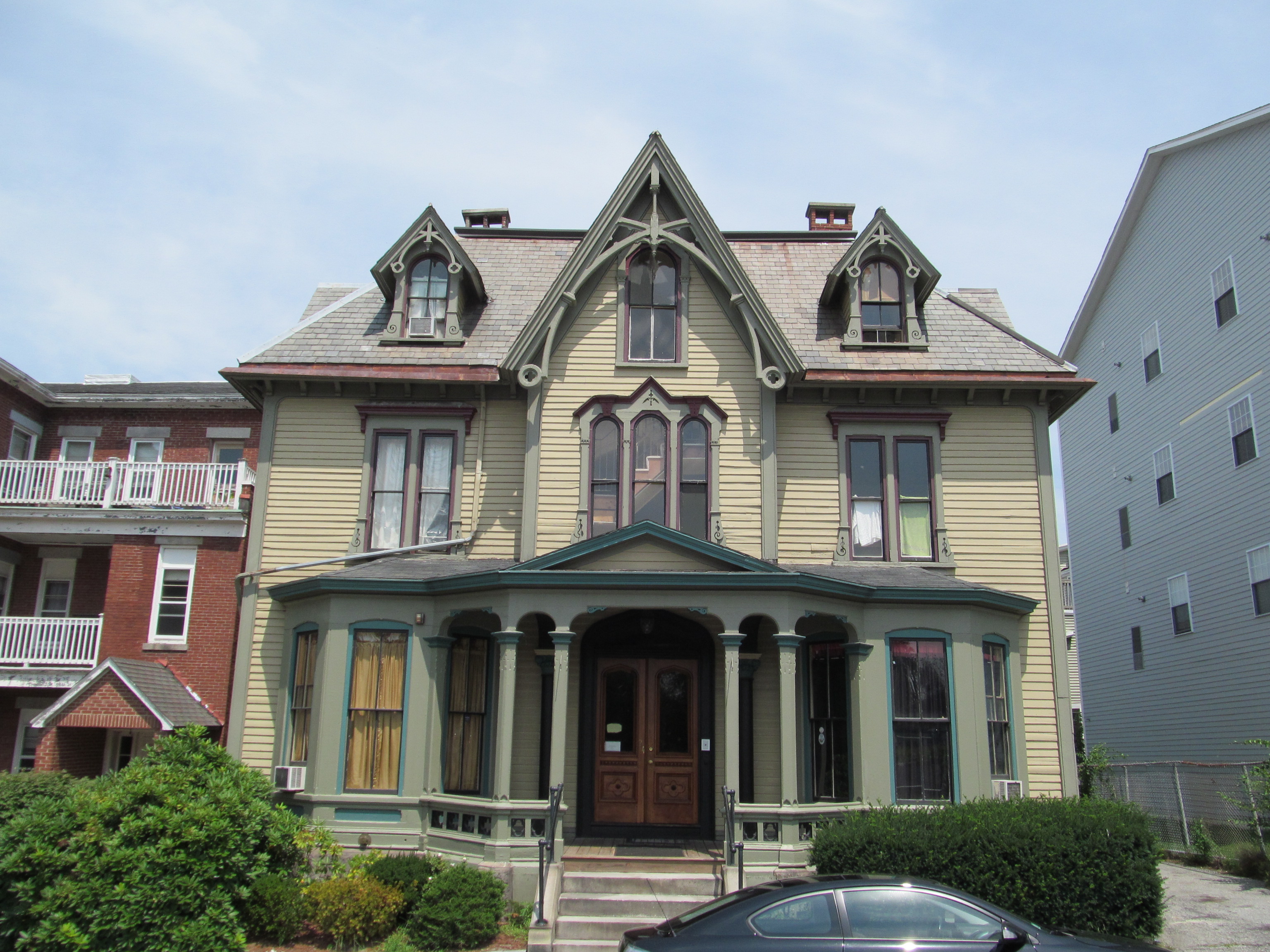 A Gothic Revival cottage with pointed-arch windows and bargeboard