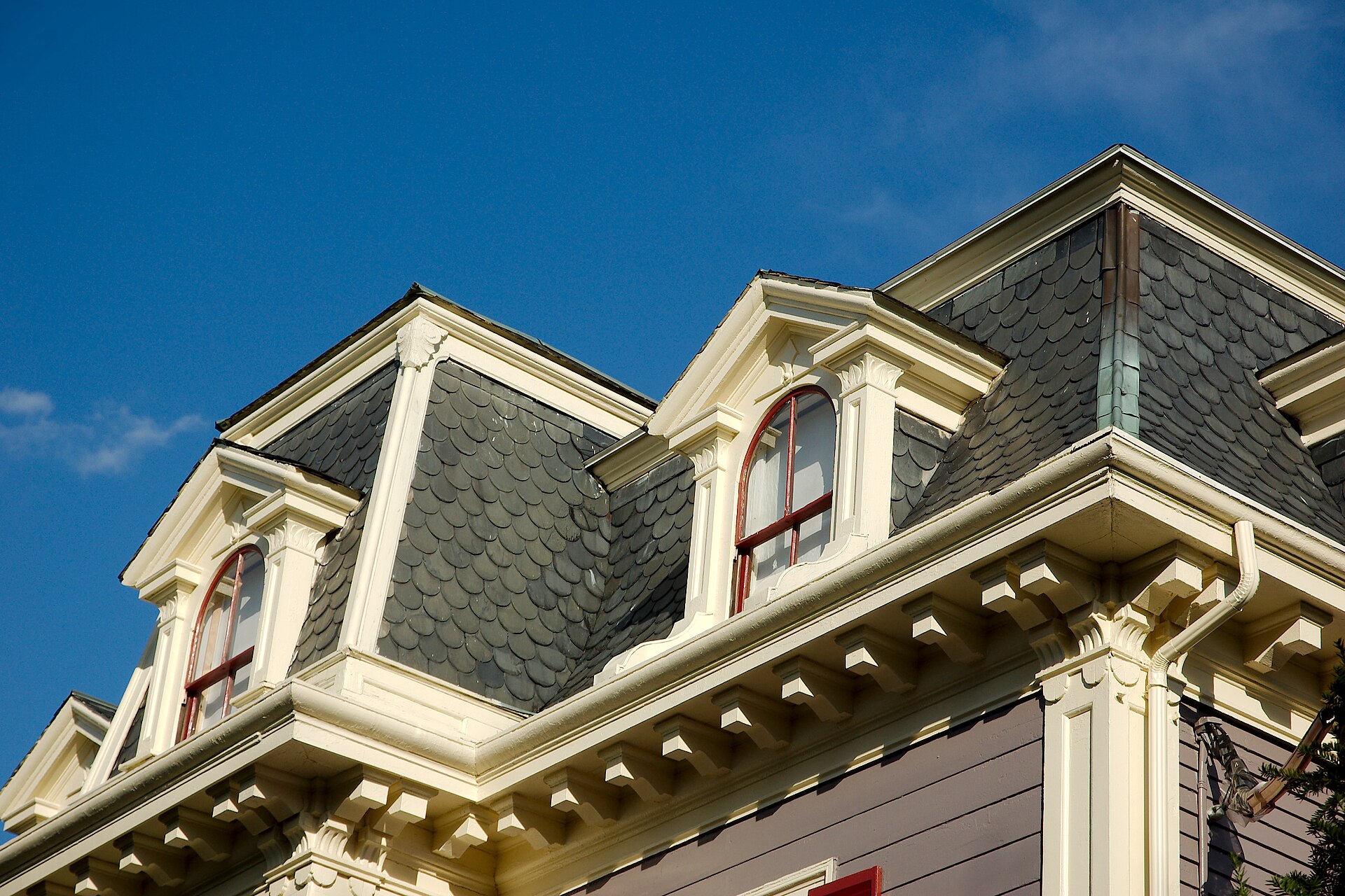 Polychrome slate on the mansard — common in high-style examples