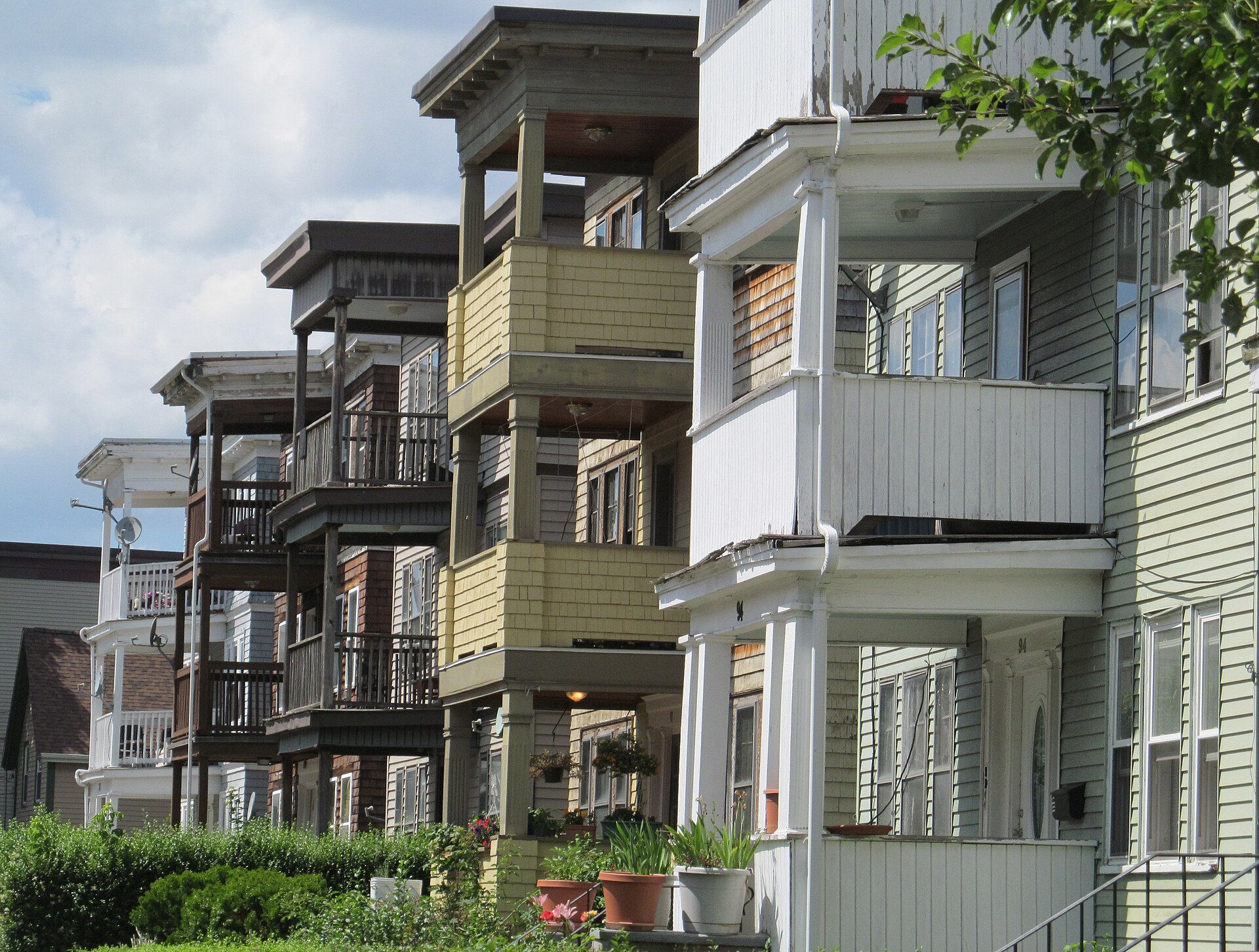 A streetscape of three-deckers, the dominant Boston working-class form